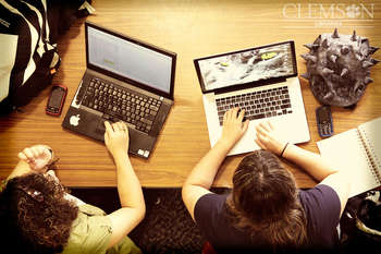 2 laptops and a pointy hat